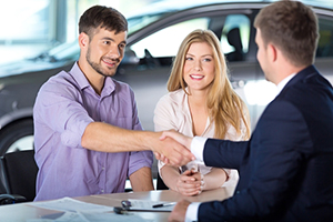 Man shaking hands with salesman